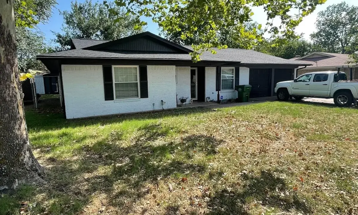 Professional roofing crew working on a residential roof in North Liberty